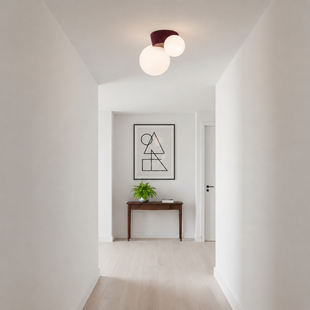 Red canopy globe light lit at the end of a plain white corridor
