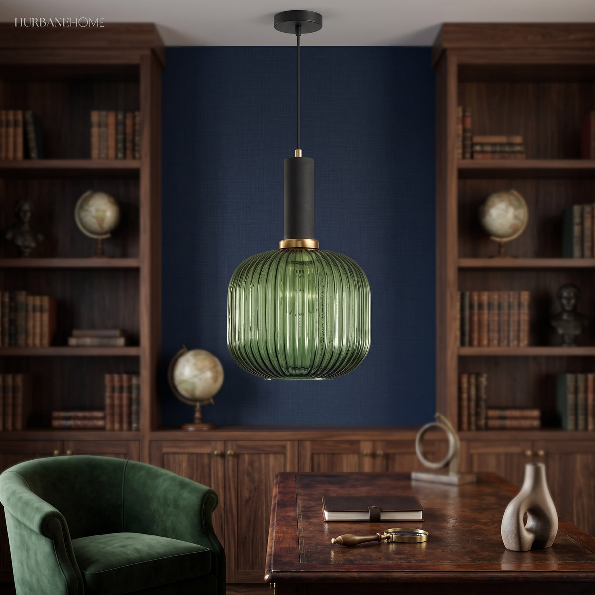 Green ribbed pendant lit in a navy study lined with bookshelves