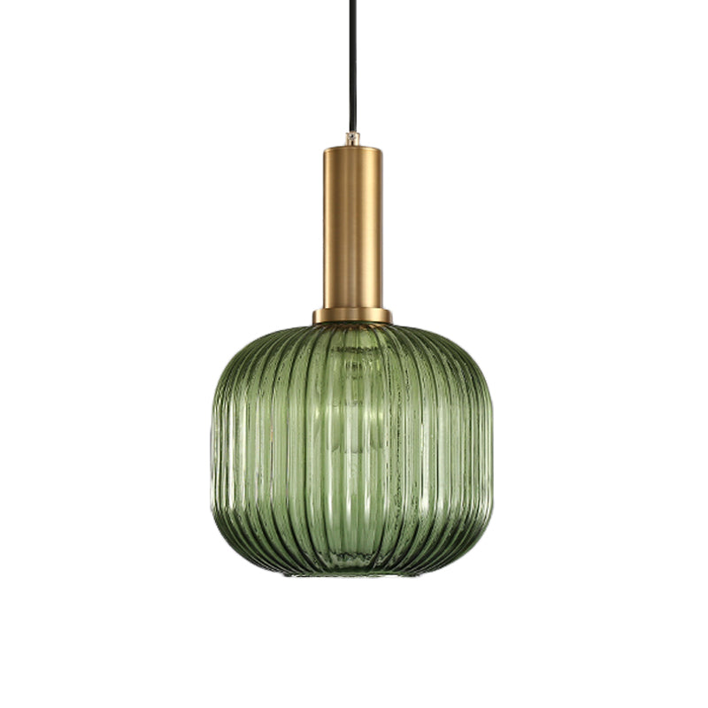 Green ribbed cylinder pendant with a brass collar on white