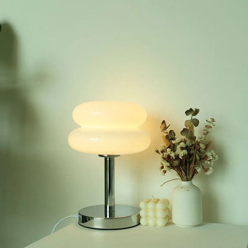 Round table lamp glowing in trichromatic light settings