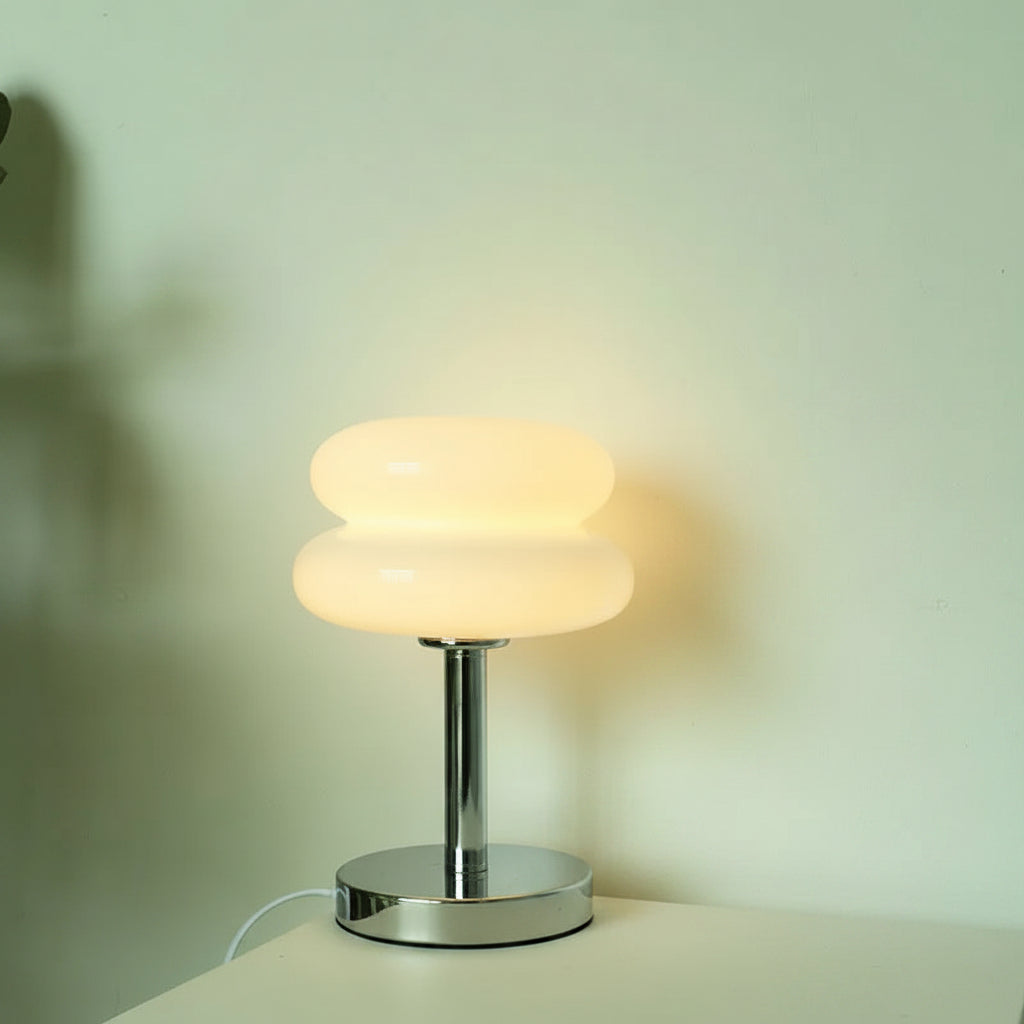 Round table lamp glowing in trichromatic light settings