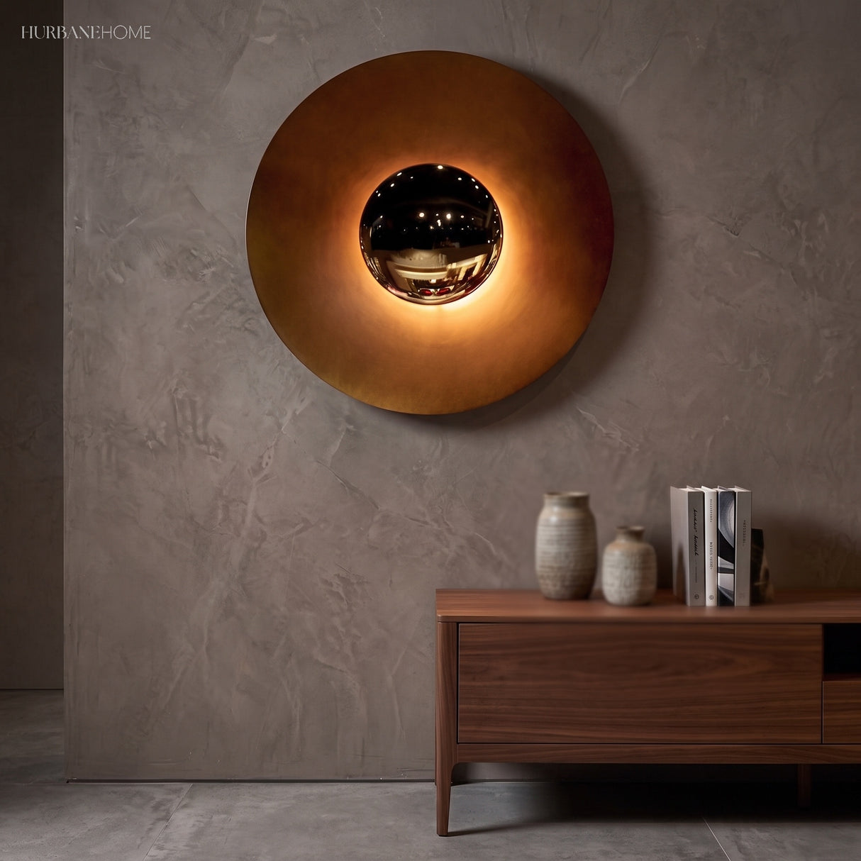 Large orange disc sconce lit above a walnut sideboard