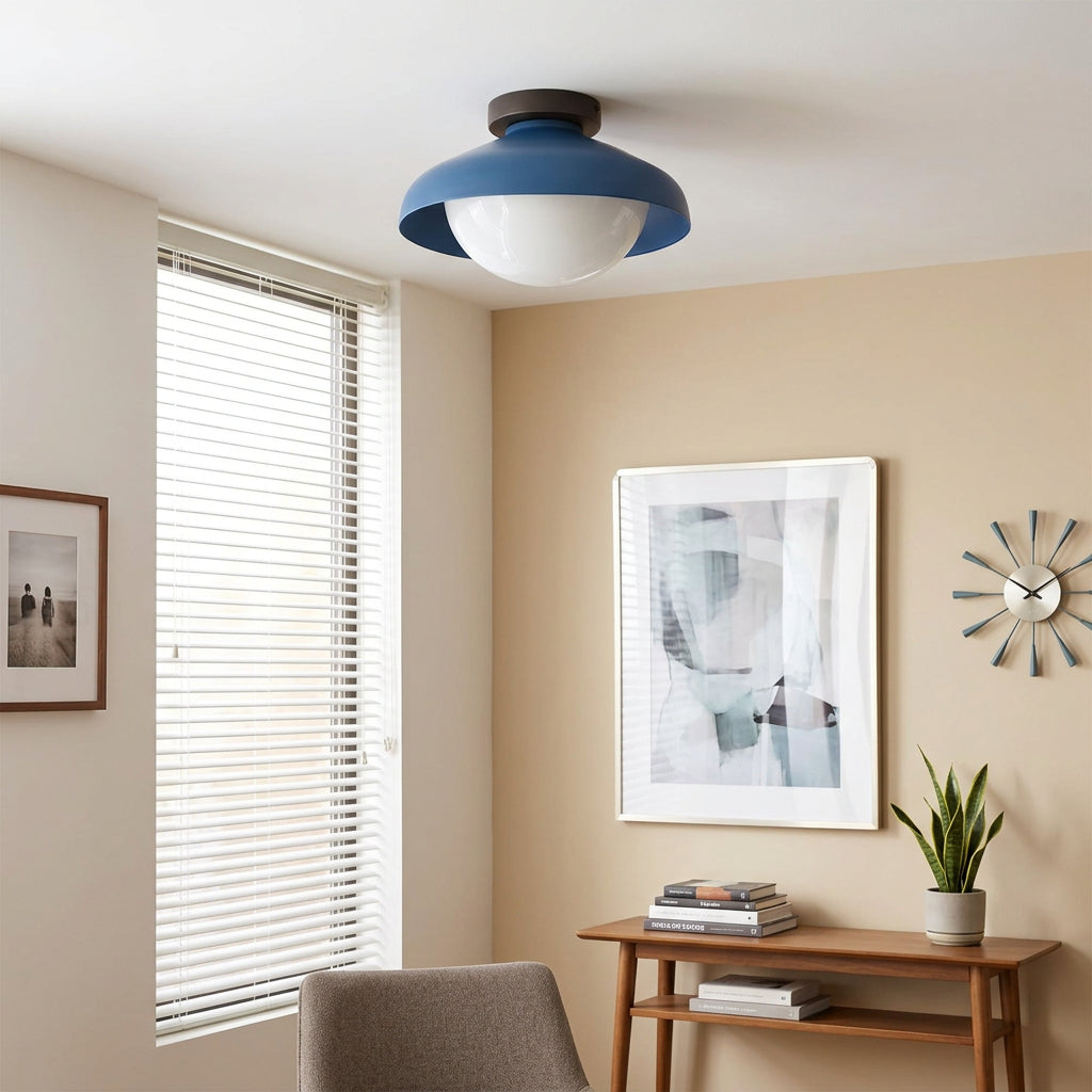 Blue dome ceiling light mounted on a white ceiling beside a window blind