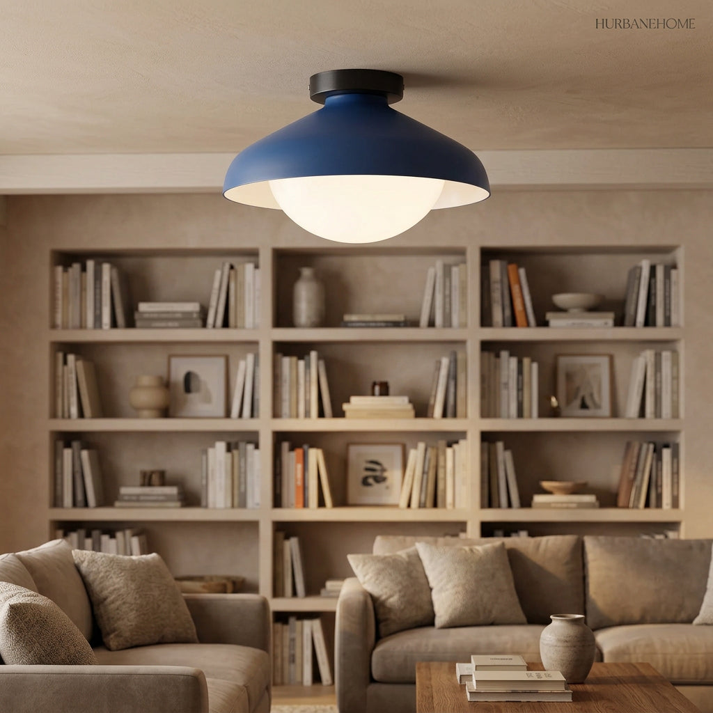 Blue dome ceiling light in a living room with artwork and open bookshelves