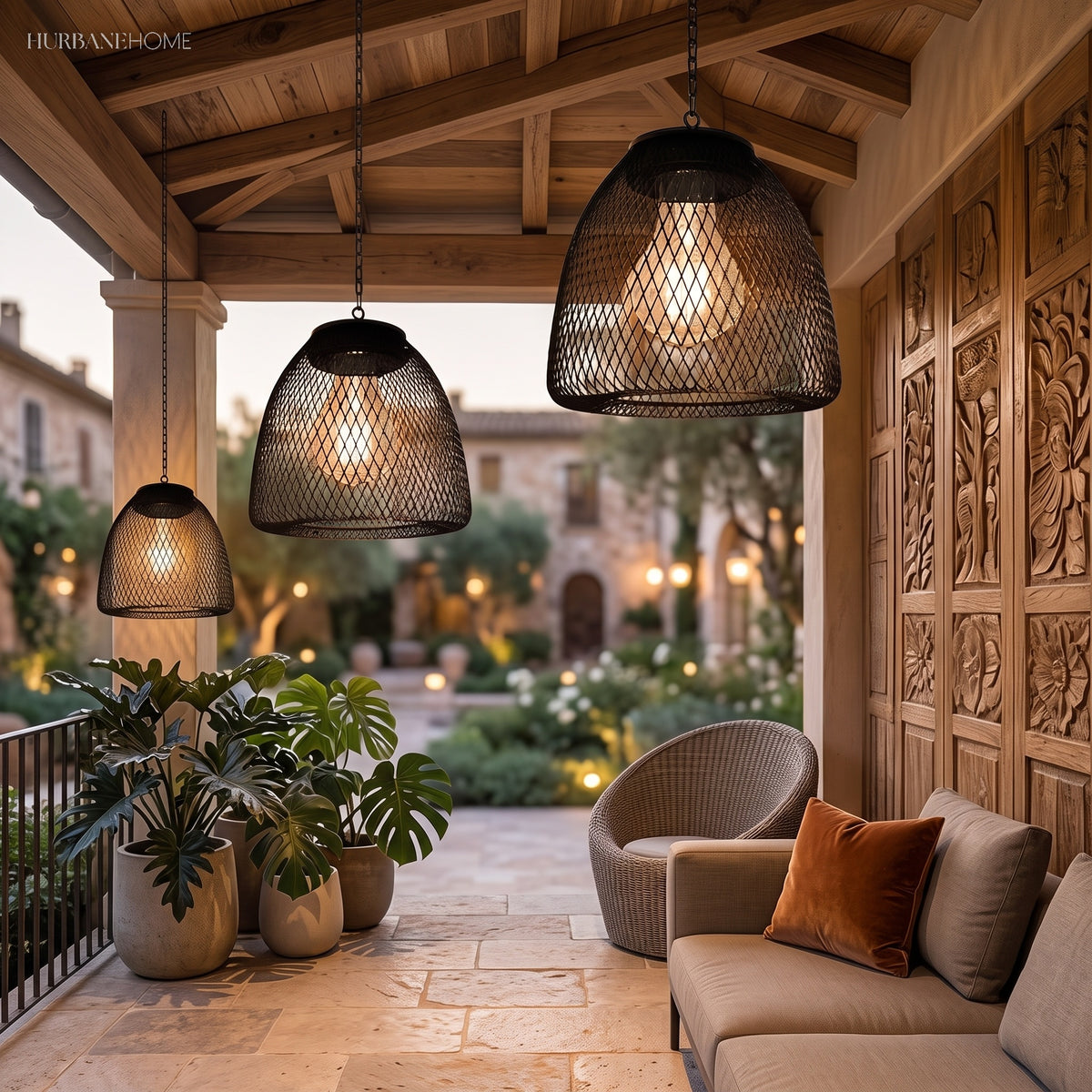 Row of woven pendant lanterns lit above an outdoor dining table