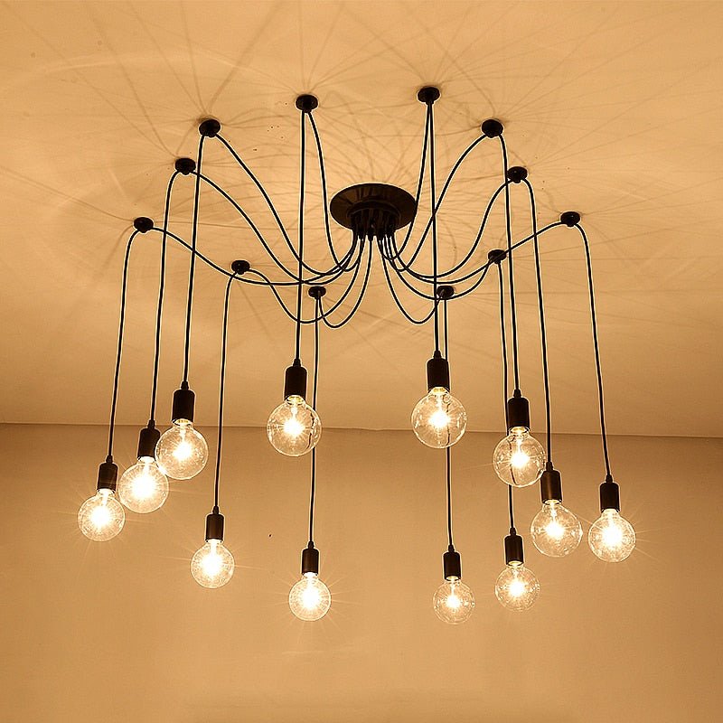 Spider chandelier with many bulbs lit against a warm brown backdrop
