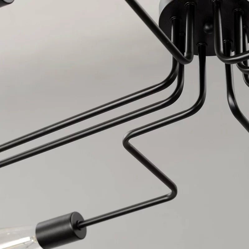 Close view of the stepped black iron arms and a bulb holder