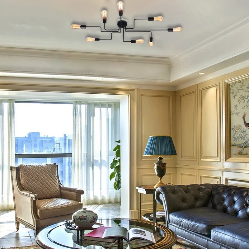 Black sputnik chandelier lit on a ceiling in a classic panelled lounge