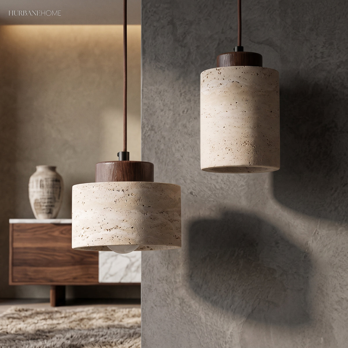 Stone pendants with dark wood caps lit against a grey wall