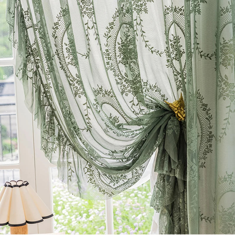 Sunlight filtering through floral embroidered sheer curtains, creating a soft, warm glow in the room.