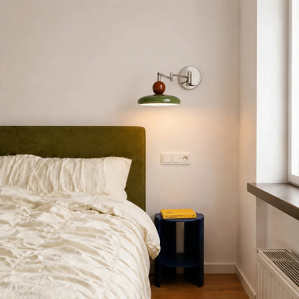Side profile of adjustable swing arm wall sconce showing folding arm