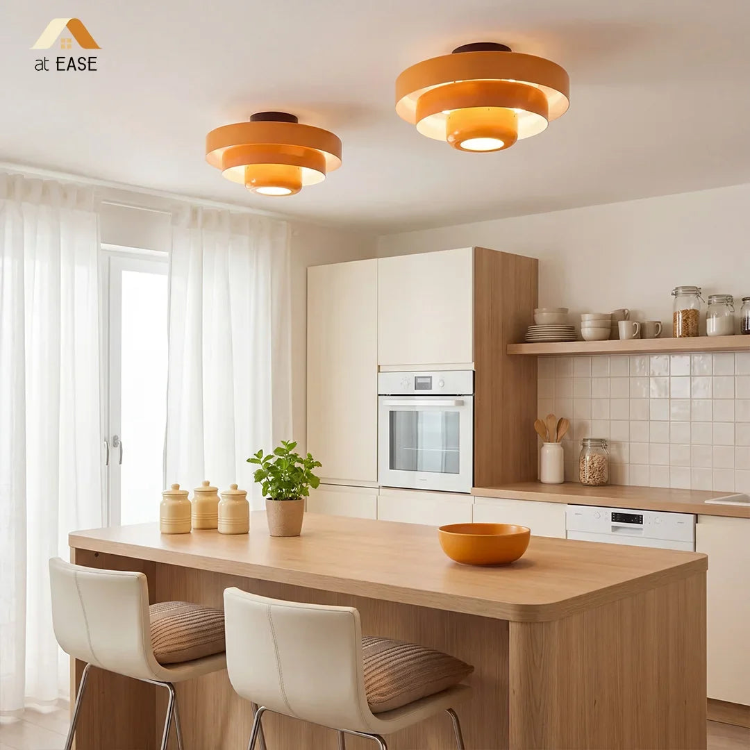 Black tiered ceiling light shown against a plain white background