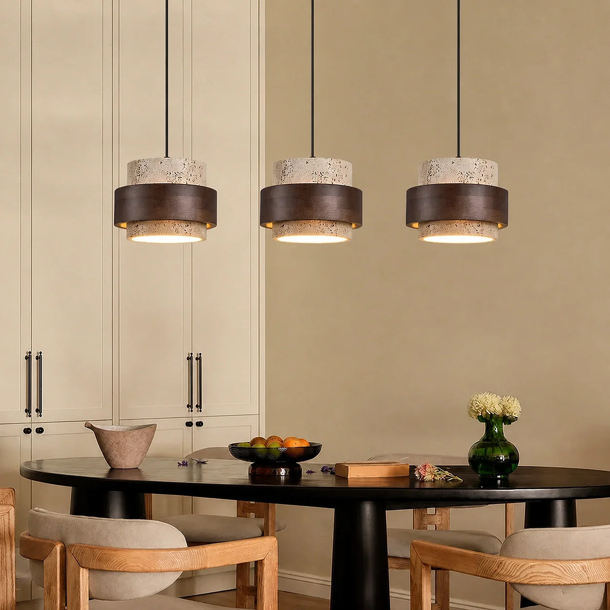 Beige stone pendant light, three-head round plate, over a dining cabinet