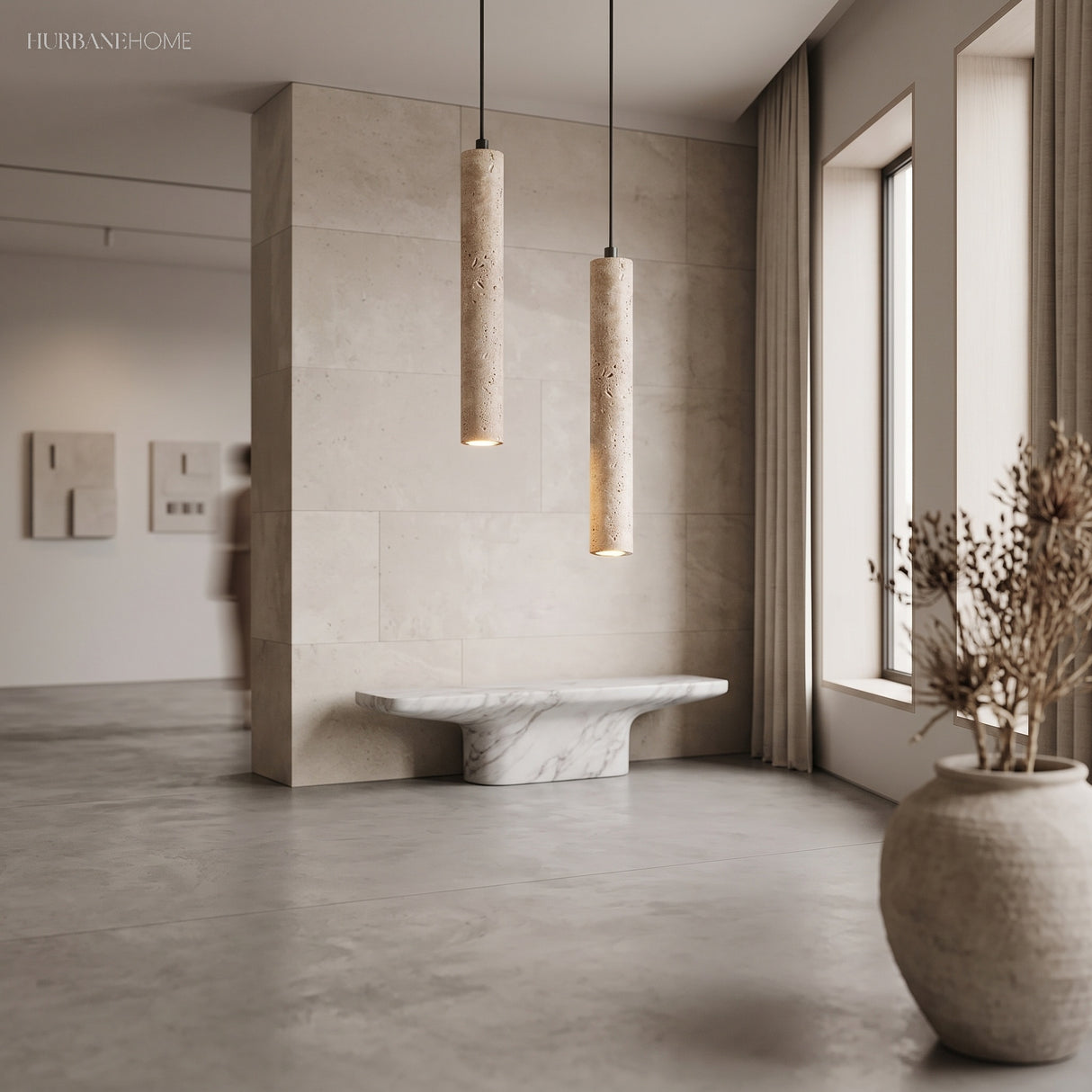 Two travertine cylinder pendants in a pale minimalist stone interior