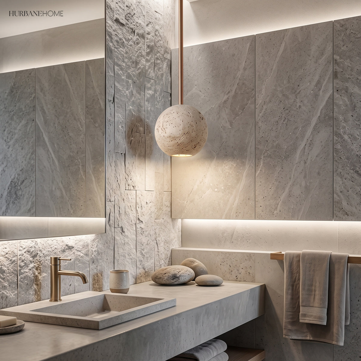 Travertine sphere pendant beside a stone clad bathroom vanity mirror