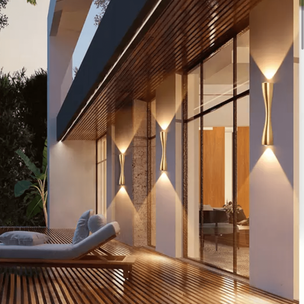 Row of gold slim wall lights lit along a timber decked walkway