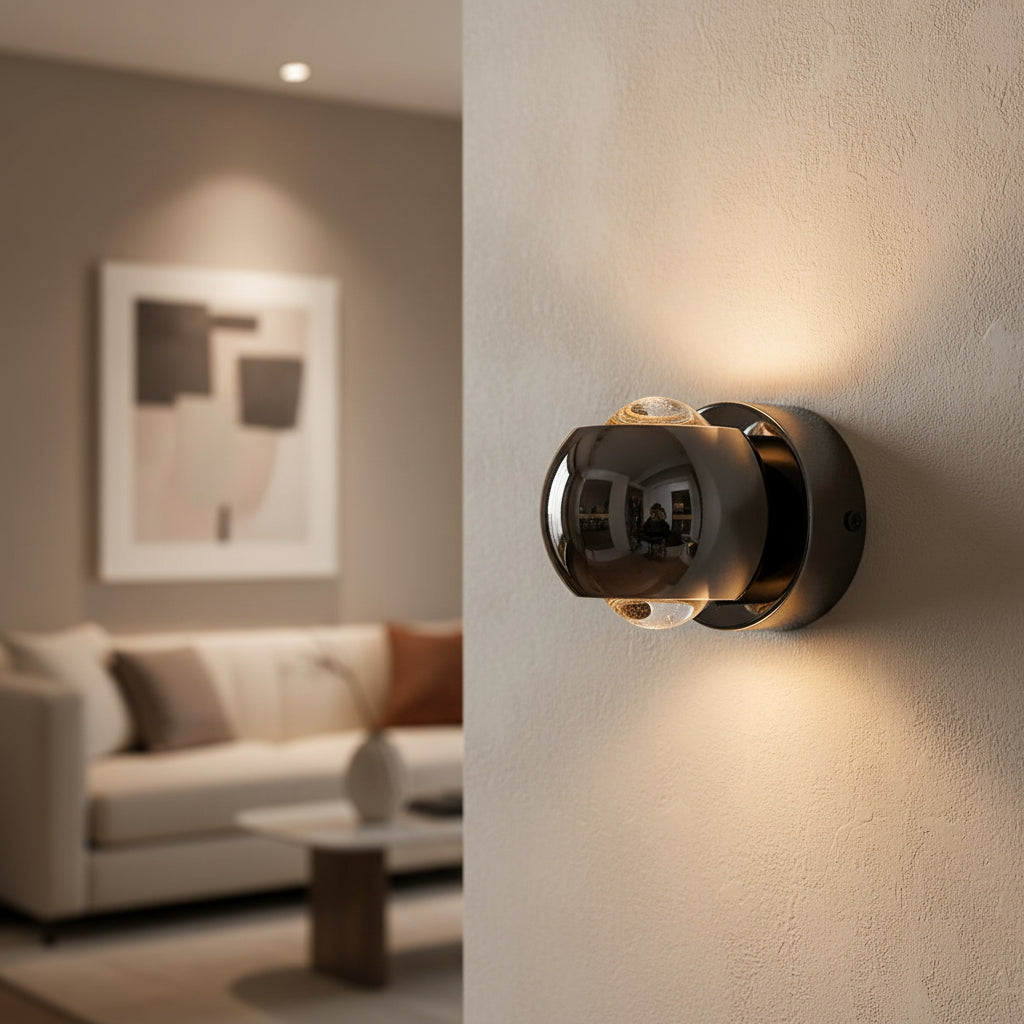 Black orb sconce shown from the side with height and width marked