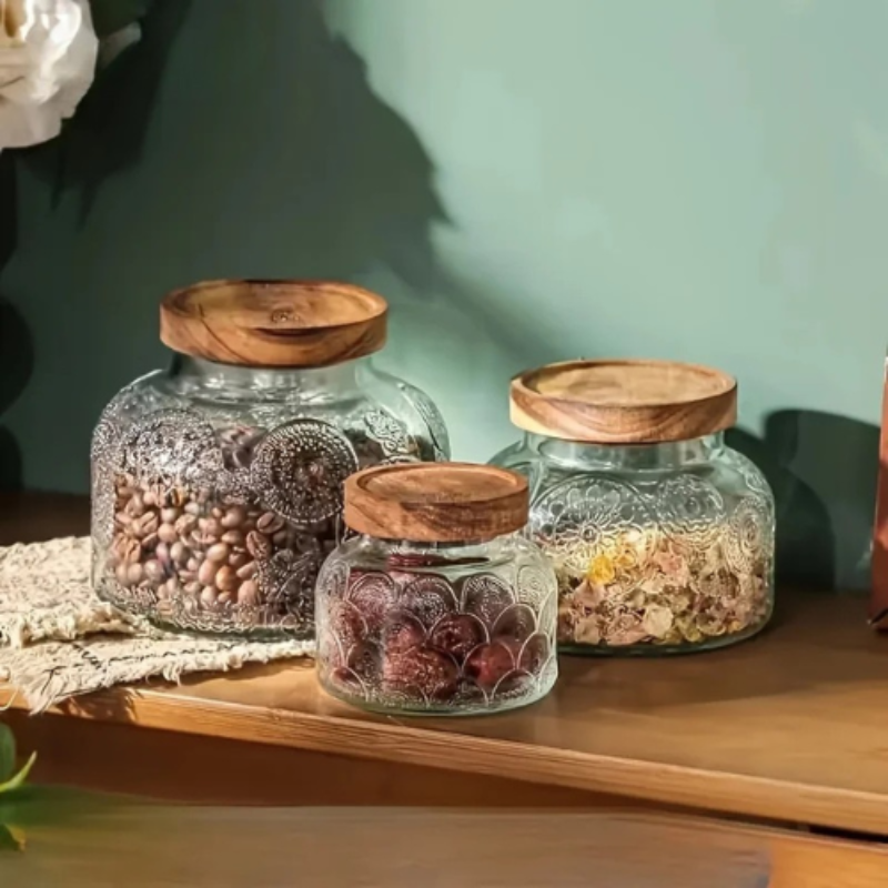 Glass pantry storage jars with lids filled with dry food items