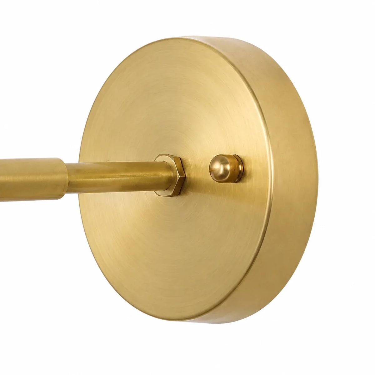 Close up of the round brass backplate and the straight mounting arm