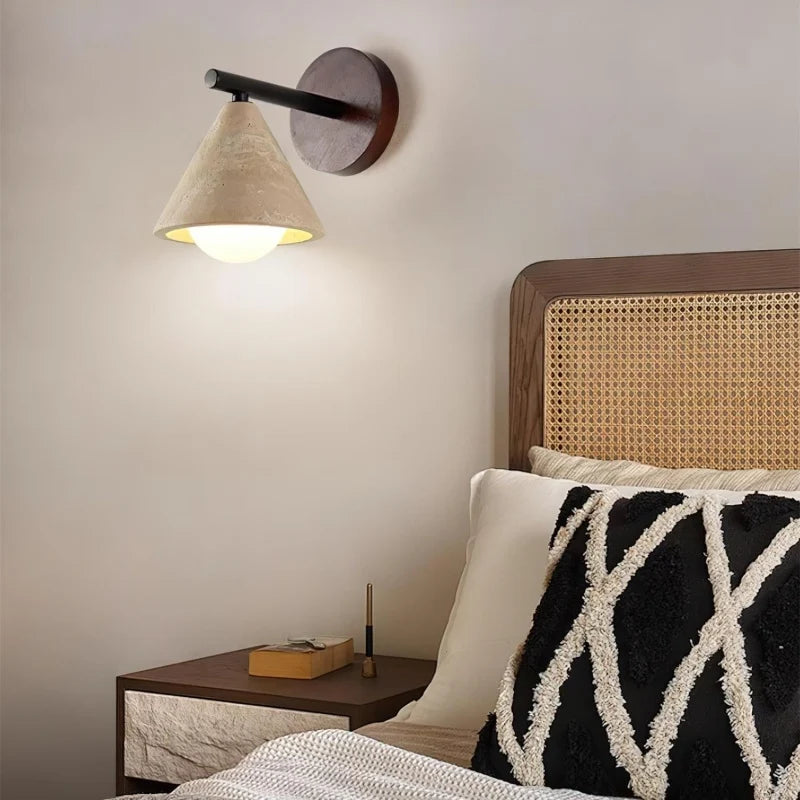 Wabi-sabi stone wall light with black metal arm
