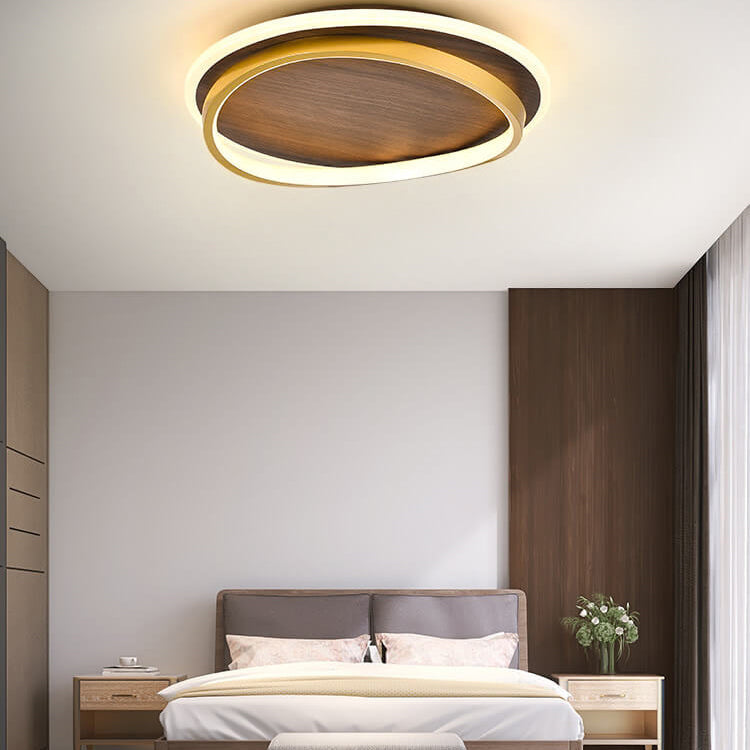 Top view of the walnut panel and gold ring on the flush mount light