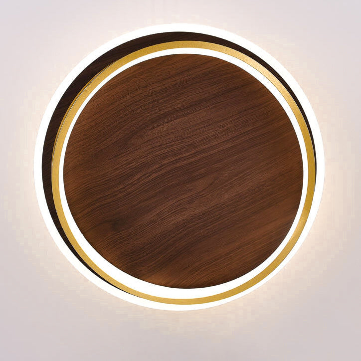 Close detail of the gold ring framing the walnut grain panel