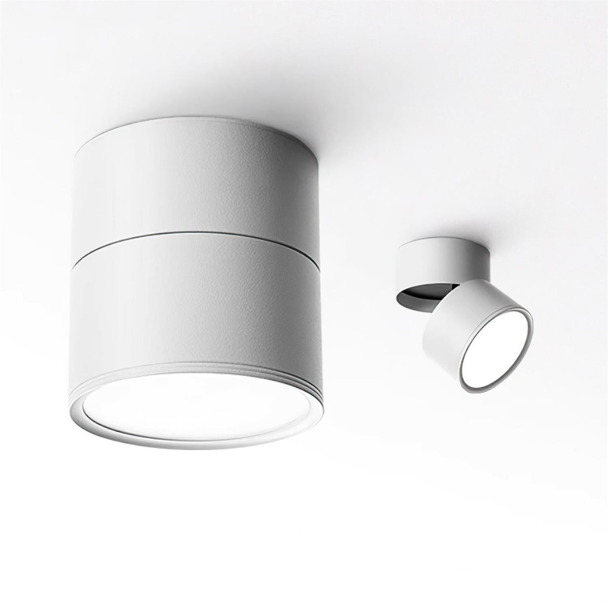 Two white spot lights shown at different tilt angles on a pale background