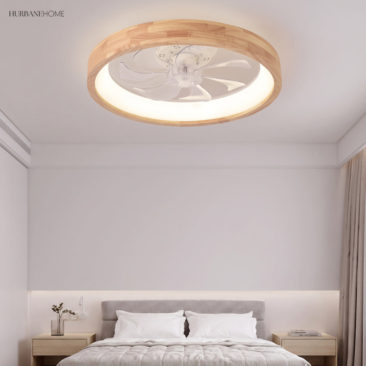 Wood ceiling fan light glowing warmly above a grey upholstered bed