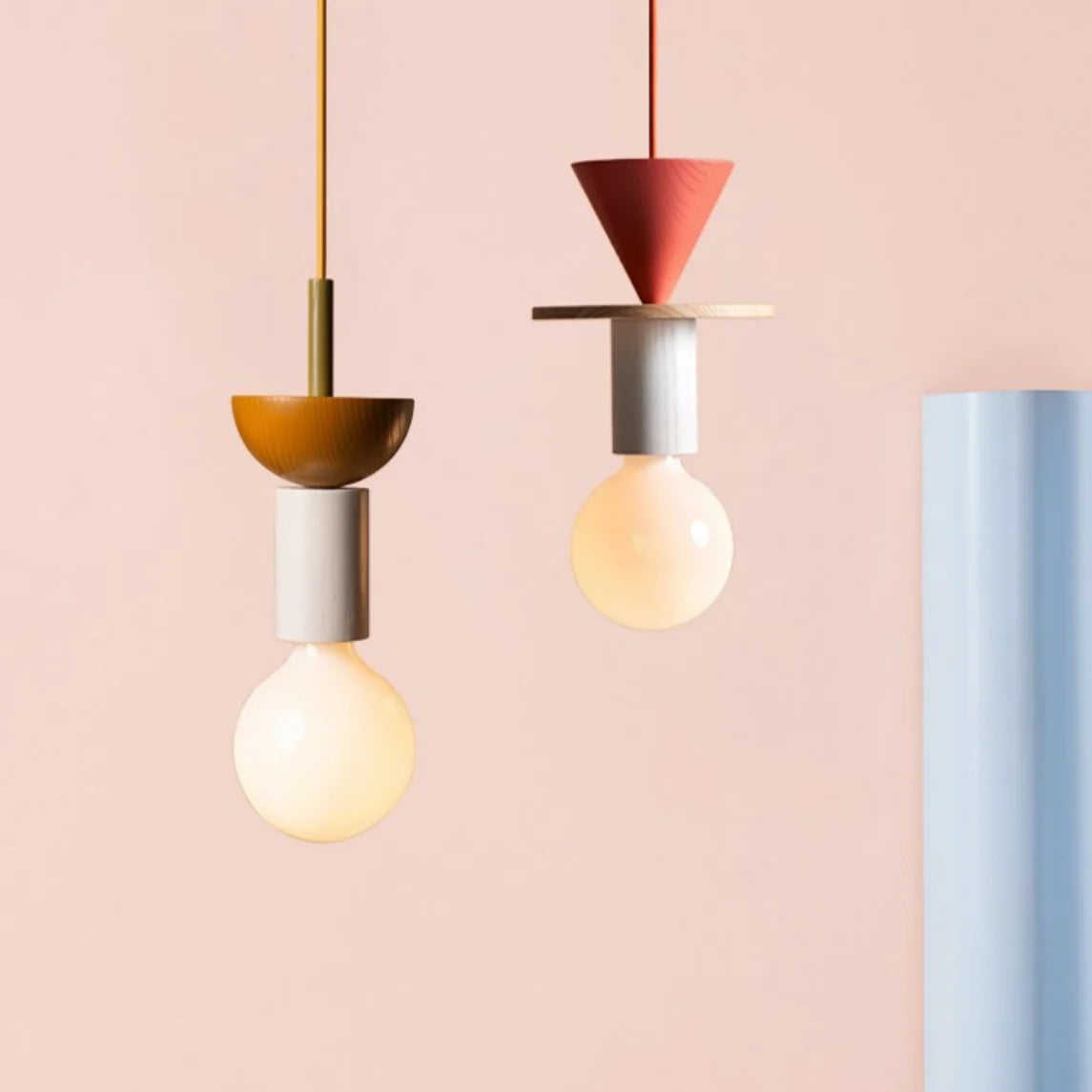 Handmade ash wood pendant light glowing softly in a decorated living space