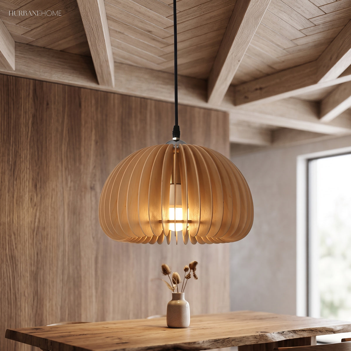 Wood slat dome pendant lit above a table under a timber ceiling