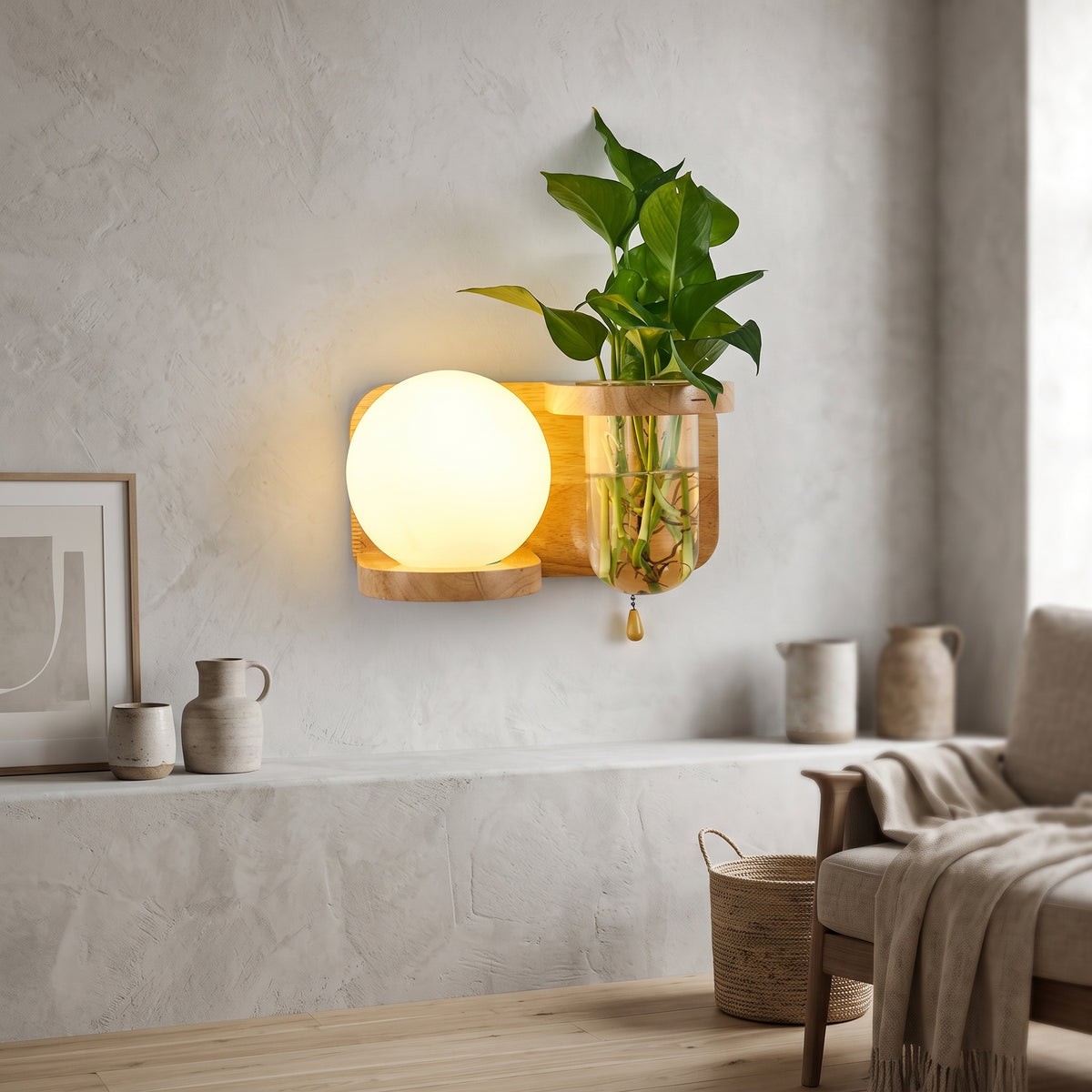 Wood wall sconce with a glass globe and a plant vase beside it