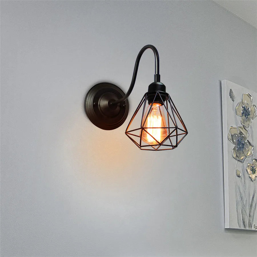 Single wrought iron wall sconce with vintage gooseneck metal cage