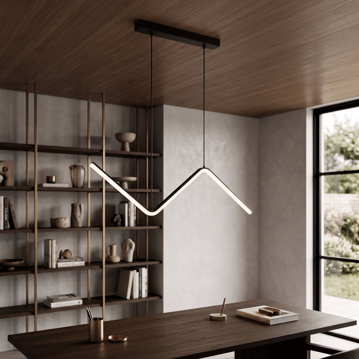 Zigzag linear pendant lit above a dark dining table in a timber lined room