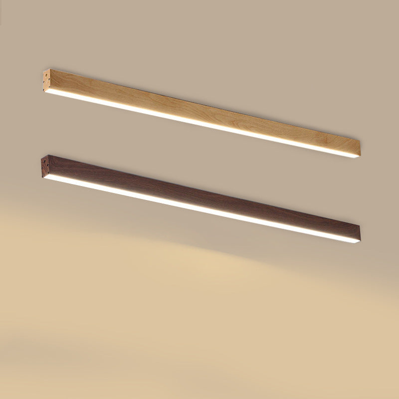Wood grain ceiling bar light installed above a living room space