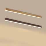 Wood grain ceiling bar light installed above a living room space