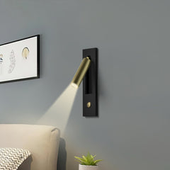 Push-button switch detail on the reading sconce backplate