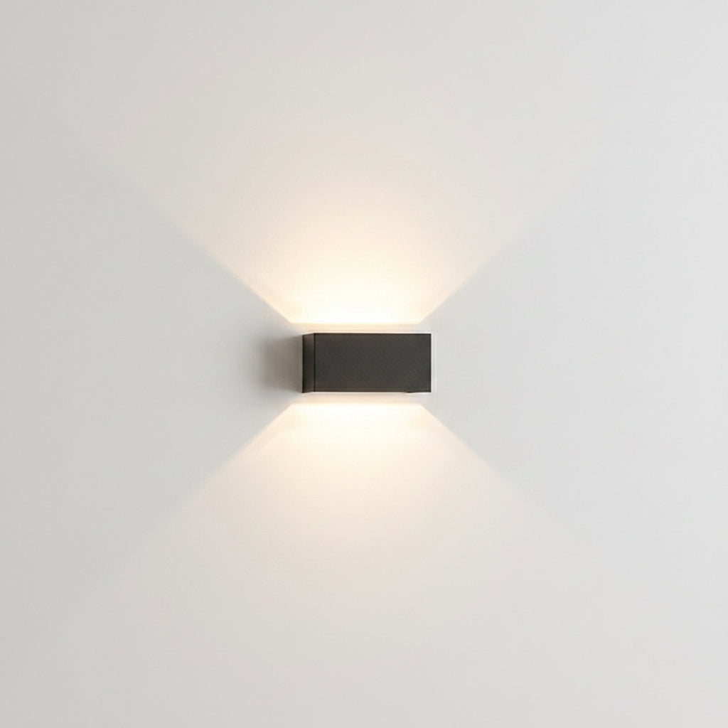 Two grey wall sconces flanking an interior doorway with soft light
