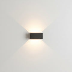 Two grey wall sconces flanking an interior doorway with soft light