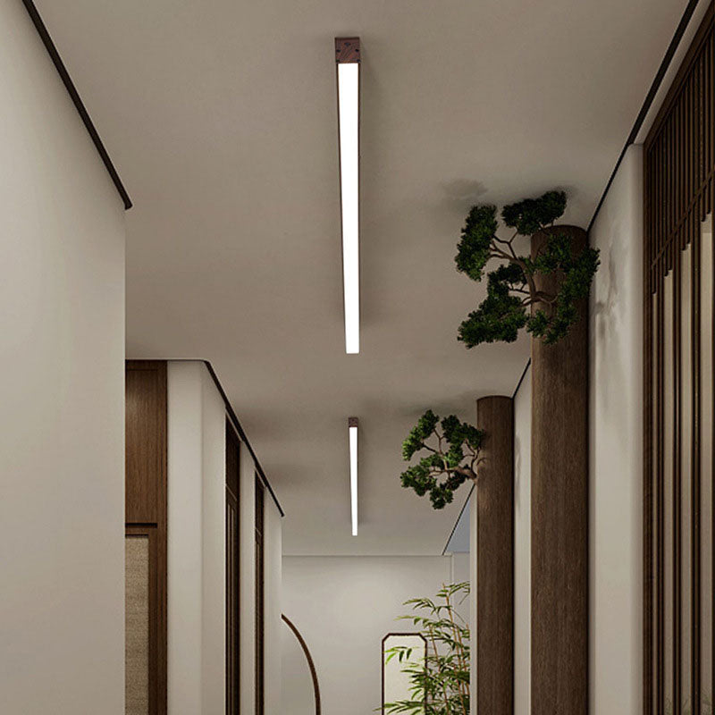 Walnut finish LED ceiling light casting even ambient light below