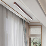 Slim wood grain LED ceiling bar highlighting a clean interior