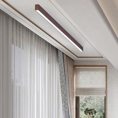 Slim wood grain LED ceiling bar highlighting a clean interior