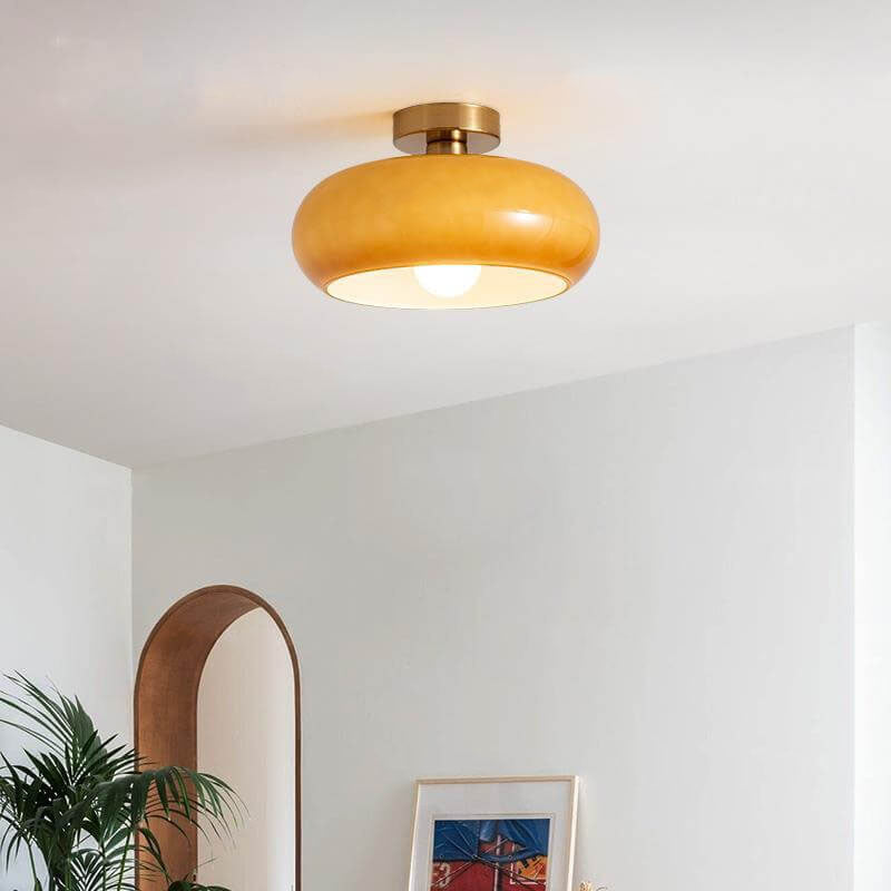 Underside of the amber glass shade with the exposed E26 bulb socket