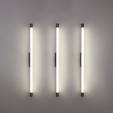 Close view of the brass end cap on the aluminum LED tube sconce