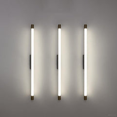 Close view of the brass end cap on the aluminum LED tube sconce