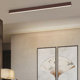 Natural wood tone flush mount bar light over neutral decor