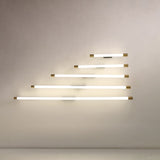 End-on view of the aluminum tube and brass cap of the wall sconce