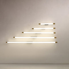 End-on view of the aluminum tube and brass cap of the wall sconce