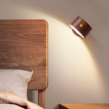 Close view of the brass touch button on the beech wall sconce head