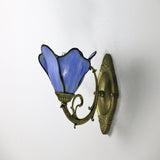 Detail of the E26 socket and bronze cap beneath the petal shade