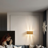 Angled view of a black up down wall sconce and its beam spread